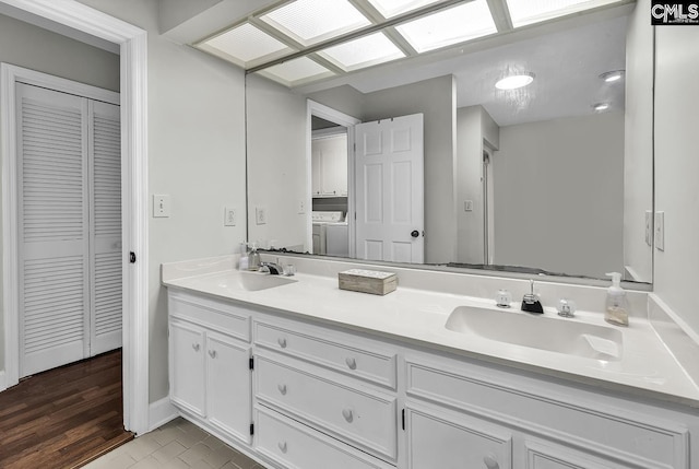 1305 Forest View Rd, Conway, SC 29526 - full bathroom with a closet, double vanity, washer / dryer, and baseboards