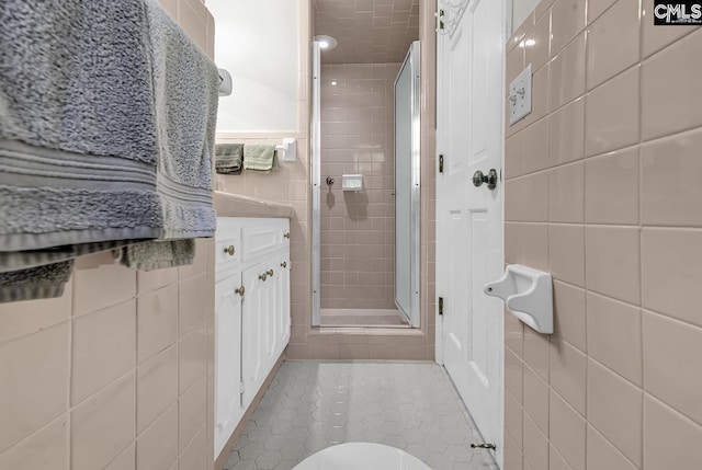 1305 Forest View Rd, Conway, SC 29526 - full bathroom featuring tile walls, a stall shower, tile patterned flooring, vanity, and toilet