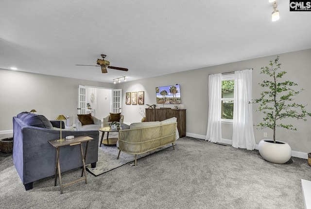 1305 Forest View Rd, Conway, SC 29526 - carpeted living room with a ceiling fan, baseboards, french doors, and a textured ceiling
