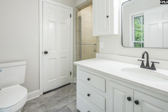 6307 Whiteoak Rd, Columbia, SC 29206 - bathroom with vanity, toilet, baseboards, and tiled shower