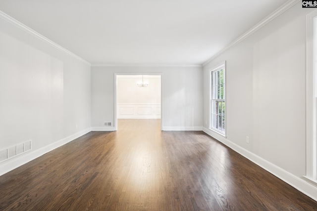 6307 Whiteoak Rd, Columbia, SC 29206 - unfurnished room with a chandelier, dark wood-style flooring, crown molding, and baseboards
