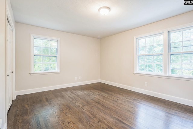 6307 Whiteoak Rd, Columbia, SC 29206 - unfurnished bedroom featuring baseboards and dark wood-type flooring