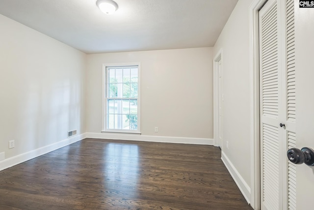 6307 Whiteoak Rd, Columbia, SC 29206 - unfurnished bedroom featuring dark wood-style flooring, a closet, and baseboards