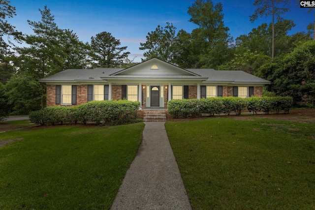 6307 Whiteoak Rd, Columbia, SC 29206 - neoclassical home featuring a yard and brick siding