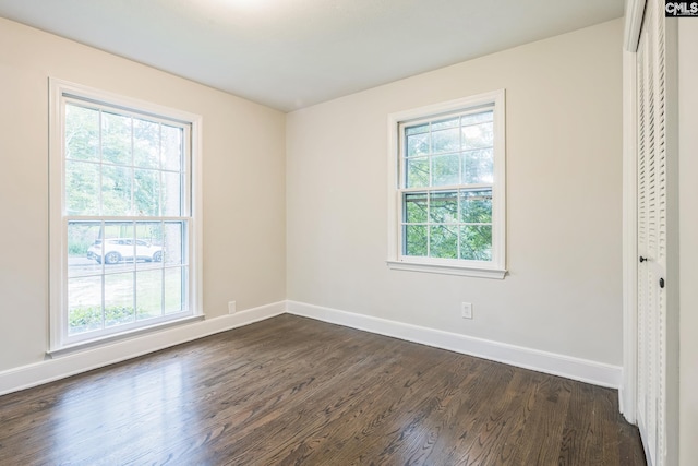 6307 Whiteoak Rd, Columbia, SC 29206 - unfurnished bedroom with dark wood finished floors, baseboards, and a closet