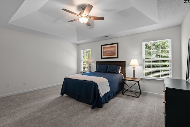 125 Oak Cove Dr, Columbia, SC 29229 - bedroom with a tray ceiling, light colored carpet, baseboards, and a ceiling fan
