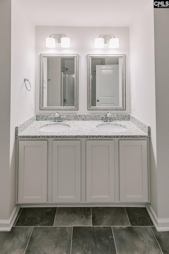 179 Marissa Ln, Lexington, SC 29072 - bathroom with double vanity, tile patterned flooring, and baseboards