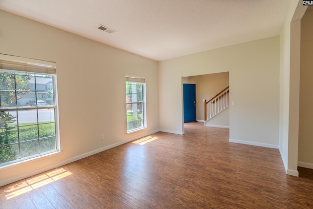 105 Songbird Ct, Chapin, SC 29036 - unfurnished room with plenty of natural light, wood finished floors, baseboards, and stairs