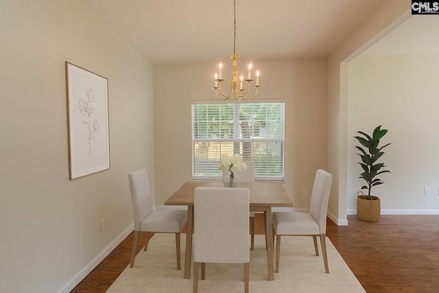 105 Songbird Ct, Chapin, SC 29036 - dining space with a chandelier, wood finished floors, and baseboards
