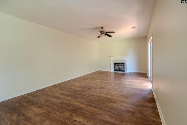 105 Songbird Ct, Chapin, SC 29036 - unfurnished living room featuring dark wood finished floors, baseboards, a fireplace, and ceiling fan