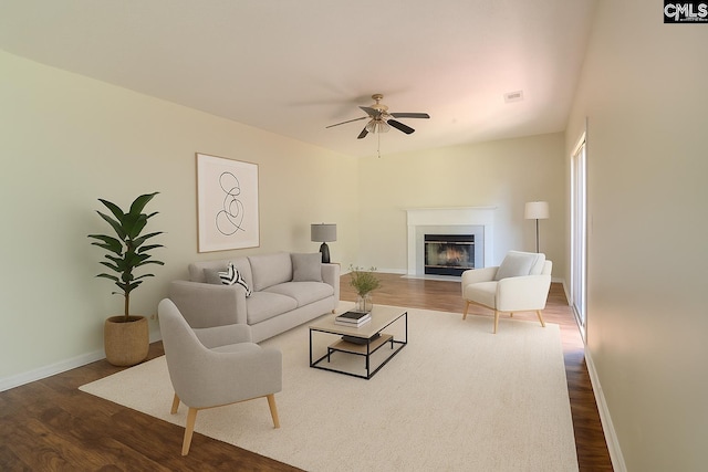 105 Songbird Ct, Chapin, SC 29036 - living room featuring wood finished floors, a fireplace with flush hearth, baseboards, and a ceiling fan