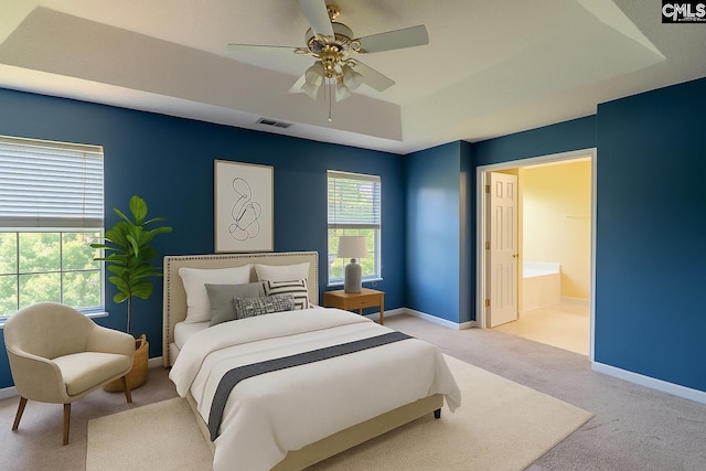 105 Songbird Ct, Chapin, SC 29036 - carpeted bedroom featuring a raised ceiling, baseboards, a ceiling fan, and connected bathroom