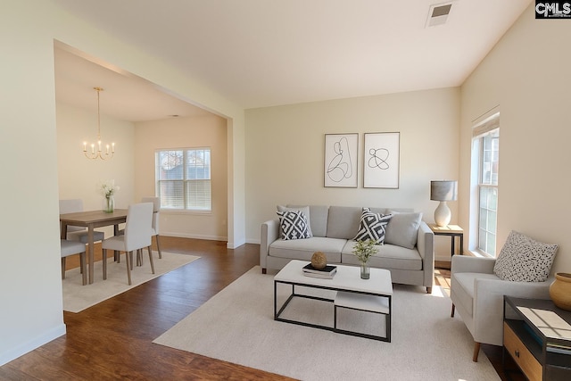 105 Songbird Ct, Chapin, SC 29036 - living room featuring wood finished floors, baseboards, and a chandelier