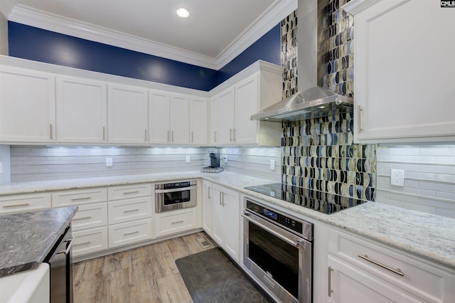 1111 High Valley Trl, Blythewood, SC 29016 - kitchen featuring stainless steel oven, wall chimney range hood, tasteful backsplash, white cabinetry, and black electric stovetop