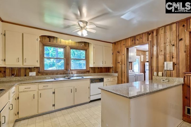 127 Lake Elizabeth Dr, Columbia, SC 29203 - kitchen with dishwasher, independent washer and dryer, a sink, ceiling fan, and white cabinets