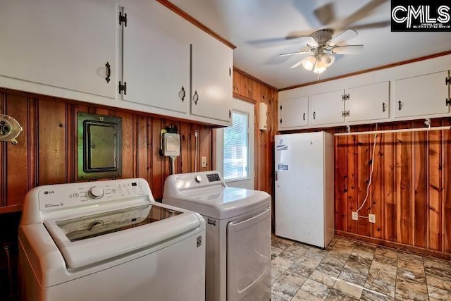 127 Lake Elizabeth Dr, Columbia, SC 29203 - laundry room featuring wood walls, independent washer and dryer, cabinet space, ceiling fan, and electric panel
