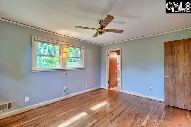 127 Lake Elizabeth Dr, Columbia, SC 29203 - unfurnished bedroom featuring baseboards, wood finished floors, crown molding, ensuite bath, and ceiling fan