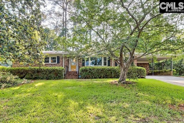 127 Lake Elizabeth Dr, Columbia, SC 29203 - view of front of home featuring brick siding, a front lawn, concrete driveway, and a carport