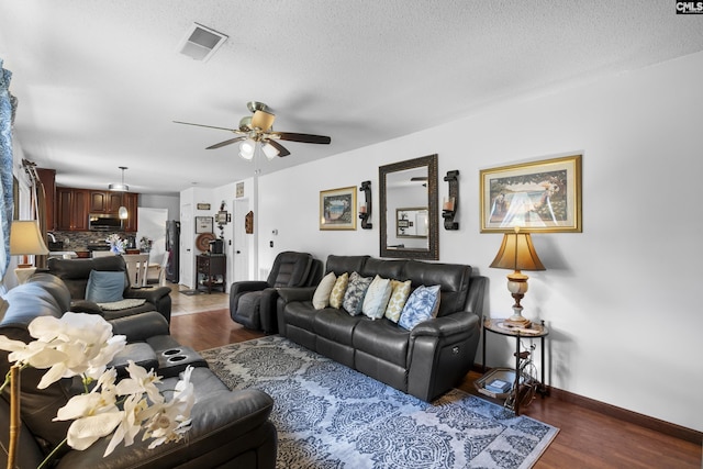300 Green Rose, Columbia, SC 29229 - living area with a ceiling fan, wood finished floors, baseboards, and a textured ceiling