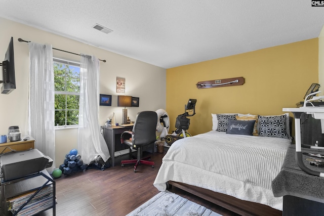 300 Green Rose, Columbia, SC 29229 - bedroom with wood finished floors and a textured ceiling