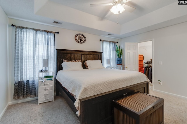 248 N High Duck Trl, Blythewood, SC 29016 - carpeted bedroom with a raised ceiling, a walk in closet, baseboards, a ceiling fan, and a closet