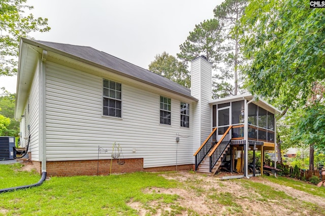 248 N High Duck Trl, Blythewood, SC 29016 - back of house featuring a sunroom, stairs, central AC unit, a chimney, and a lawn