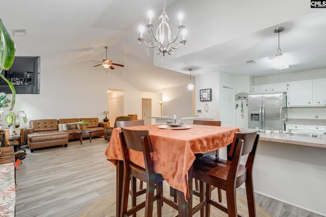 248 N High Duck Trl, Blythewood, SC 29016 - dining room with light wood-style flooring, ceiling fan, vaulted ceiling, and a chandelier