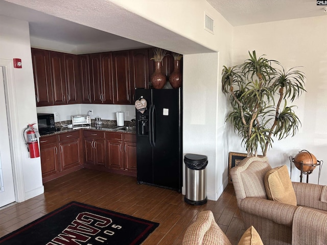 1085 Shop Rd Unit 117, Columbia, SC 29201 - kitchen with black appliances, dark wood finished floors, and dark stone countertops