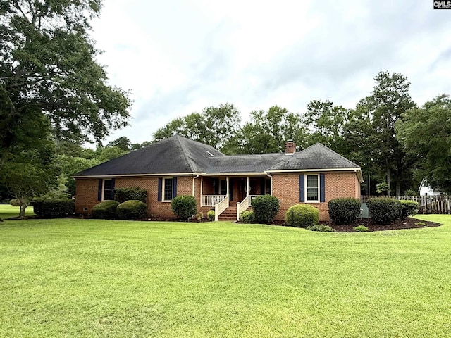 3270 Winchester Ln, Orangeburg, SC 29118 - ranch-style home with a porch, a front yard, brick siding, and a chimney