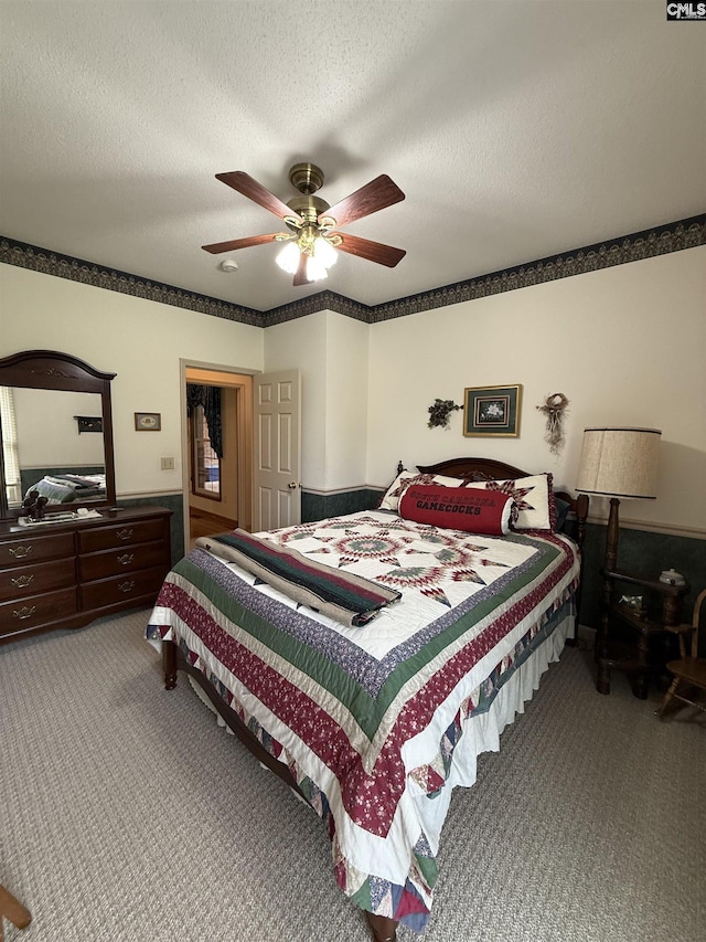 3270 Winchester Ln, Orangeburg, SC 29118 - bedroom featuring carpet floors, a textured ceiling, and a ceiling fan