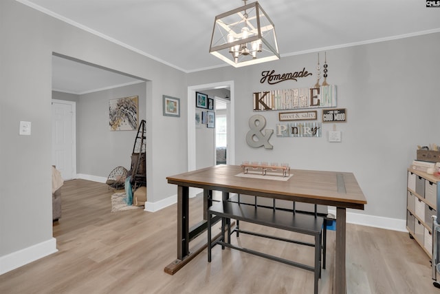 1321 C Ave, West Columbia, SC 29169 - dining room featuring light wood-style floors, a chandelier, baseboards, and crown molding