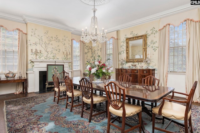 1100 W Carolina Ave, Hartsville, SC 29550 - dining space featuring a chandelier, wallpapered walls, wood finished floors, crown molding, and wainscoting