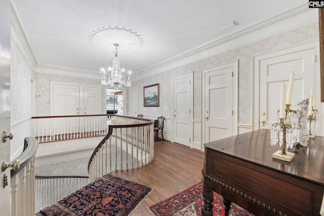 1100 W Carolina Ave, Hartsville, SC 29550 - hallway with ornamental molding, wallpapered walls, wood finished floors, and a chandelier