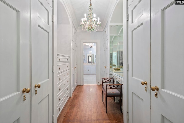 1100 W Carolina Ave, Hartsville, SC 29550 - hallway featuring a chandelier, wood finished floors, and ornamental molding