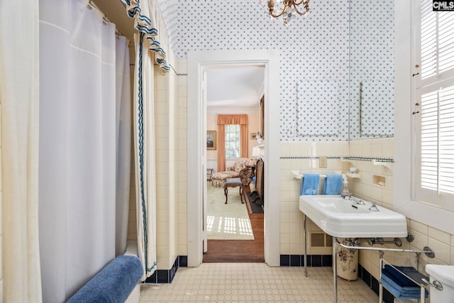 1100 W Carolina Ave, Hartsville, SC 29550 - full bathroom featuring tile walls, a shower with shower curtain, and crown molding