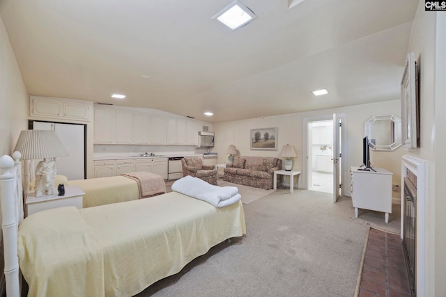 1100 W Carolina Ave, Hartsville, SC 29550 - carpeted bedroom featuring freestanding refrigerator, recessed lighting, and a sink