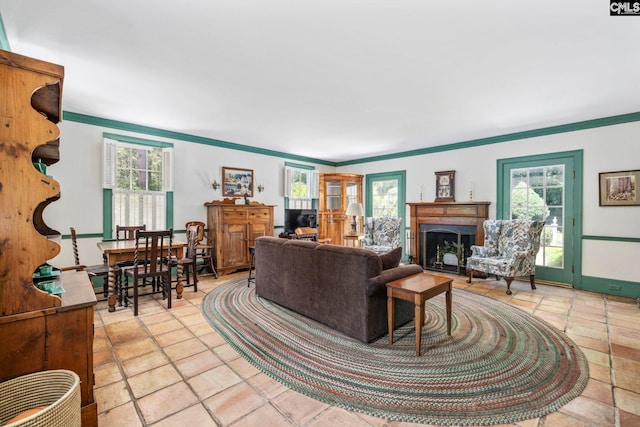 1100 W Carolina Ave, Hartsville, SC 29550 - living area with healthy amount of natural light, ornamental molding, and a fireplace