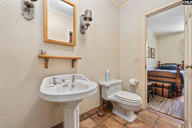 1100 W Carolina Ave, Hartsville, SC 29550 - bathroom featuring crown molding, toilet, tile patterned flooring, wallpapered walls, and a sink
