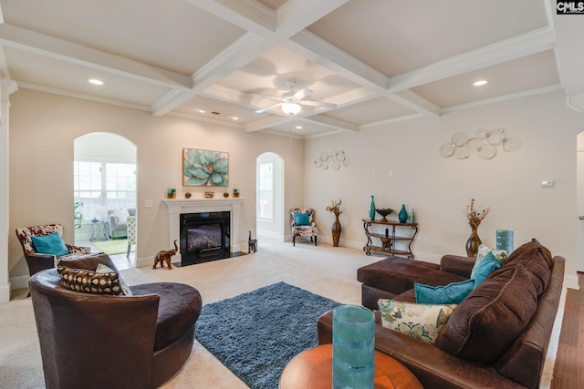 535 New Cut Ln, Blythewood, SC 29016 - living area with arched walkways, beamed ceiling, plenty of natural light, a fireplace with flush hearth, and coffered ceiling