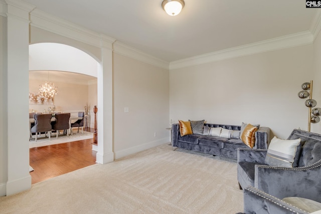 535 New Cut Ln, Blythewood, SC 29016 - carpeted living area with ornamental molding, arched walkways, a chandelier, and baseboards
