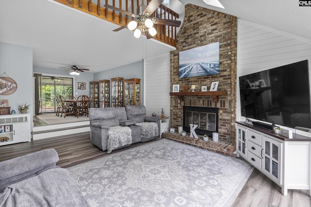 421 Willow Bend Dr, Columbia, SC 29212 - living room featuring ceiling fan, wood finished floors, high vaulted ceiling, a fireplace, and wood walls