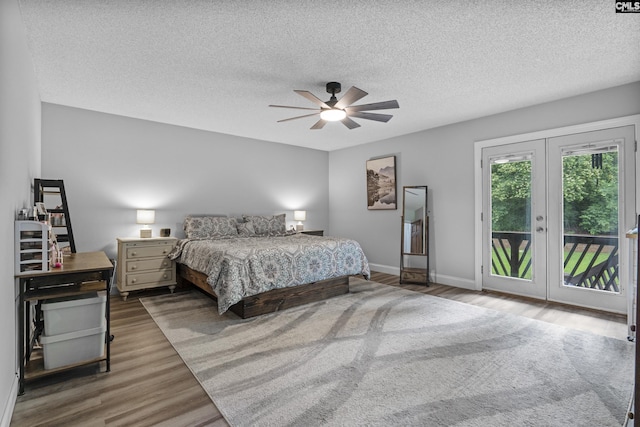 421 Willow Bend Dr, Columbia, SC 29212 - bedroom featuring access to outside, wood finished floors, french doors, a textured ceiling, and baseboards