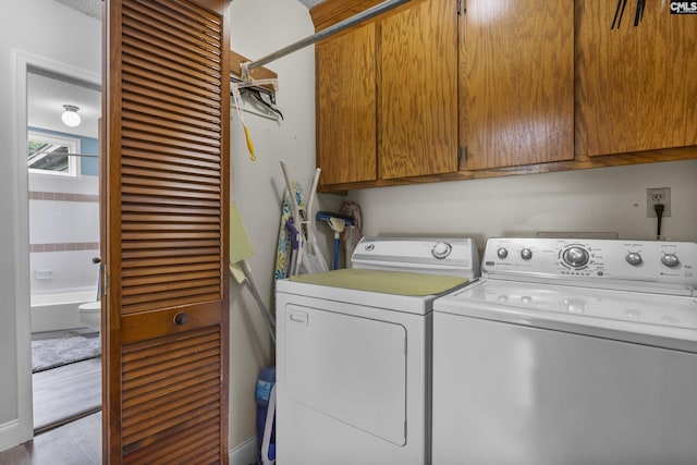 421 Willow Bend Dr, Columbia, SC 29212 - laundry room featuring cabinet space, washer and dryer, and wood finished floors