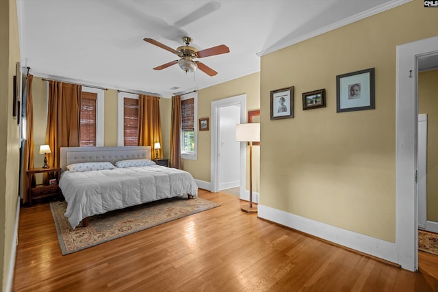 107 Southwood, Columbia, SC 29205 - bedroom featuring hardwood / wood-style floors, ornamental molding, and a ceiling fan