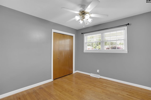 344 Rawls Dr, Leesville, SC 29070 - unfurnished bedroom with light wood-style flooring, a closet, and a ceiling fan