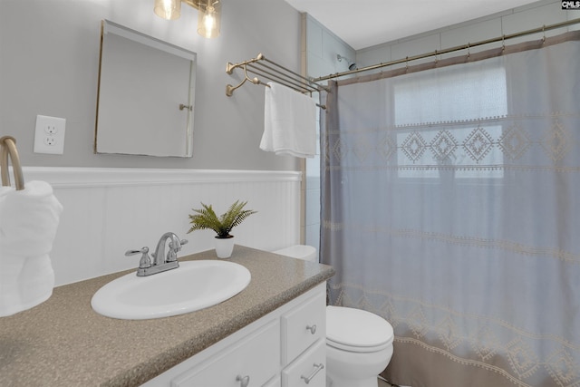 344 Rawls Dr, Leesville, SC 29070 - full bath with vanity, curtained shower, and a wainscoted wall