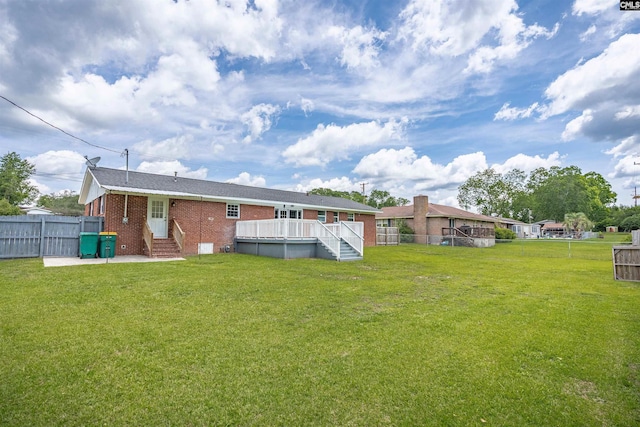 344 Rawls Dr, Leesville, SC 29070 - back of house featuring entry steps, a fenced backyard, brick siding, and a deck