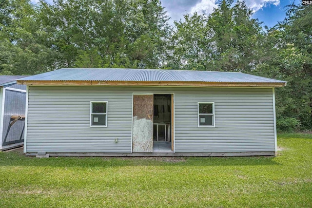 344 Rawls Dr, Leesville, SC 29070 - back of property with a metal roof, a yard, and an outdoor structure