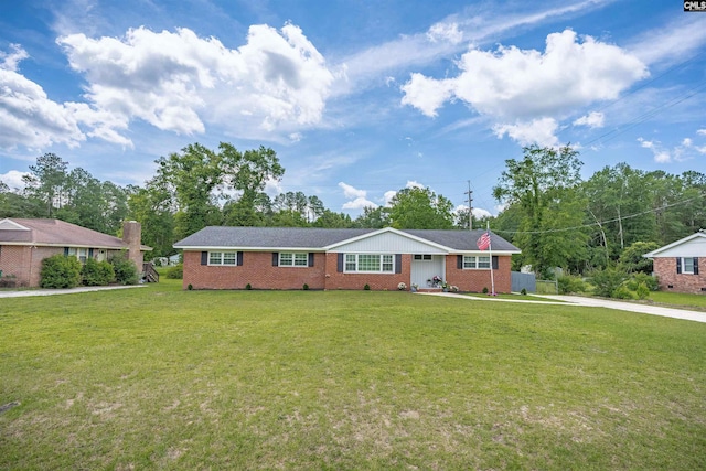 344 Rawls Dr, Leesville, SC 29070 - ranch-style house with brick siding, a front yard, and concrete driveway