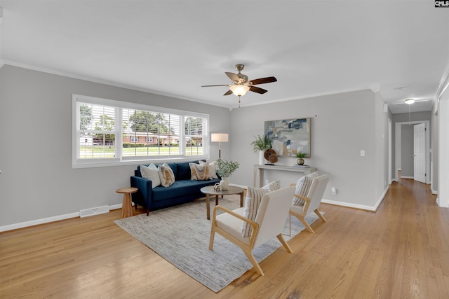 344 Rawls Dr, Leesville, SC 29070 - living room with crown molding, a ceiling fan, and light wood-style flooring